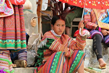 How to Save Money on Your Trip To Vietnam - Girl at Bac Ha Market Sapa www.compassandfork.com