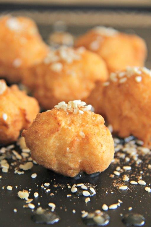 Light, moist and tasty these greek donuts are a great end to any meal! Cinnamon, walnuts, sesame and honey make it a healthy treat treat! The Best Authentic Loukoumades Greek Donuts Recipe www.compassandfork.com