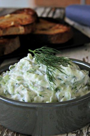 Greek Tzatziki easy and healthy dip you can make at home. Great for a party- serve with ciabatta bread or a selection of fresh vegetables for dipping It's gluten free, paleo and vegetarian. www.compassandfork.com