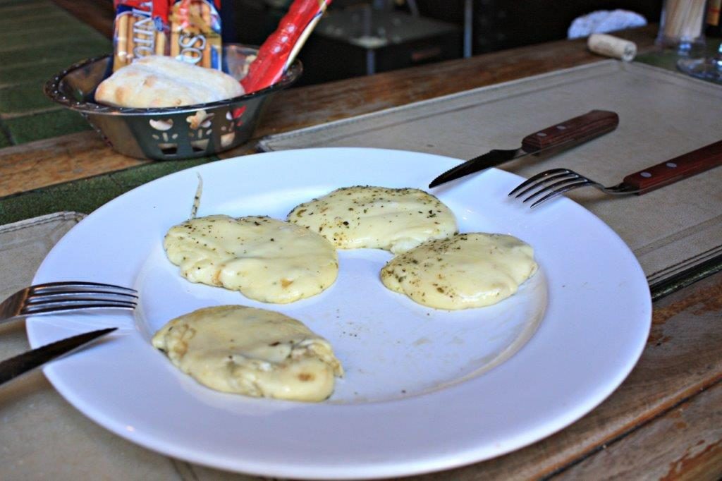Awesome provoleta grilled provolone cheese is quick and easy - in Montevideo www.compassandfork.com