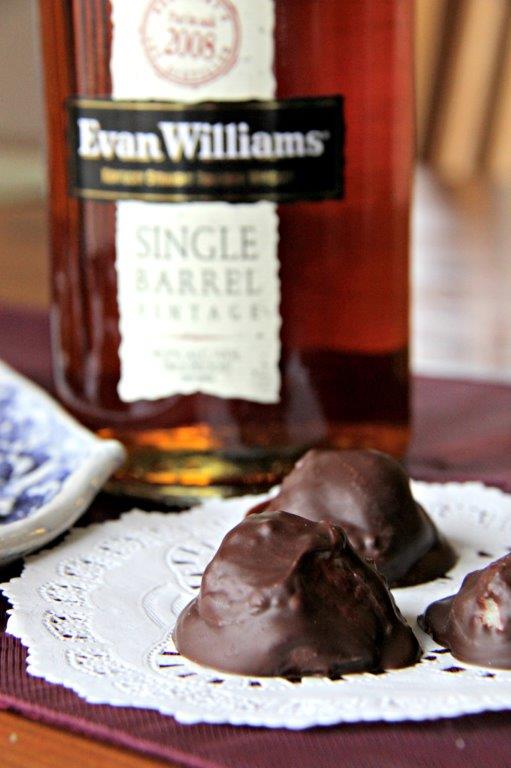These simple kentucky bourbon balls are the perfect after dinner treat! A bitesize combination of chocolate and bourbon and they are easy to make too! Gluten free & vegetarian www.compassandfork.com